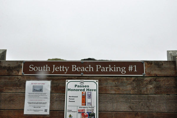 sign: South Jetty Beach Parking area